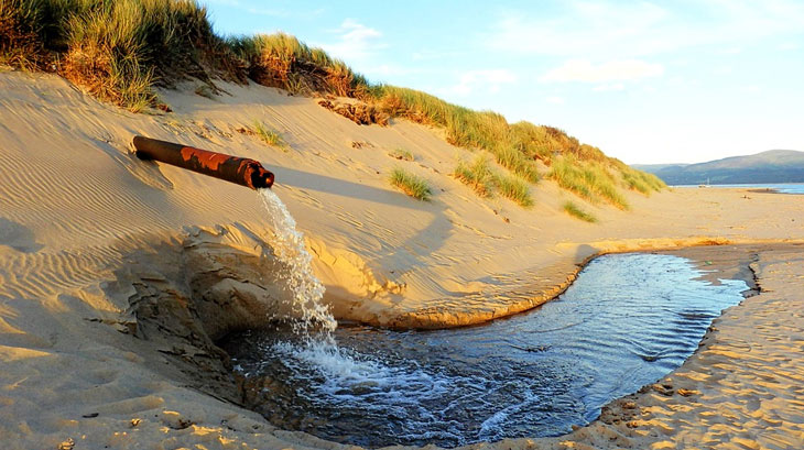 pipe dune sand water sea waste